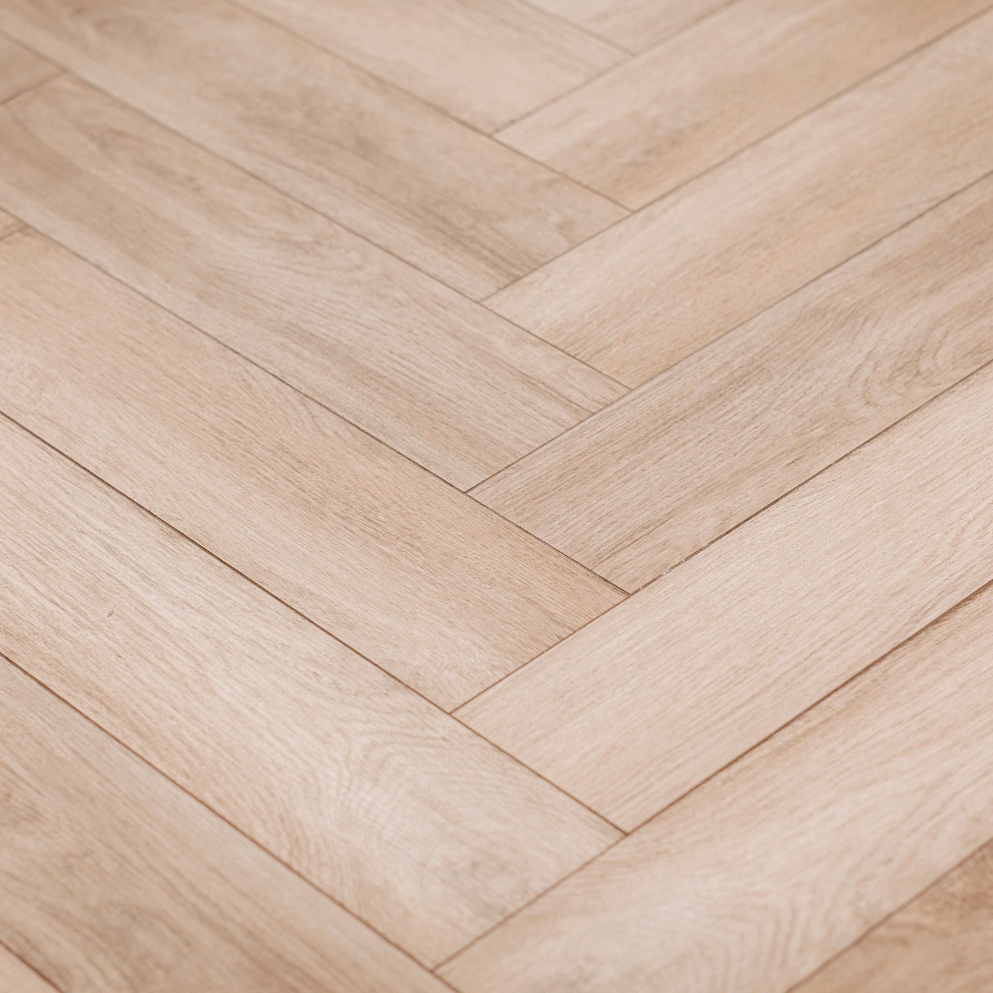 Custom-cut herringbone white oak flooring for luxury home renovation