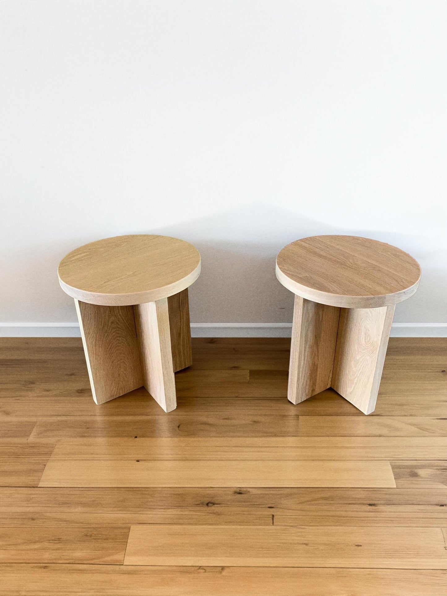 two Custom white oak round side tables with a sleek and timeless look