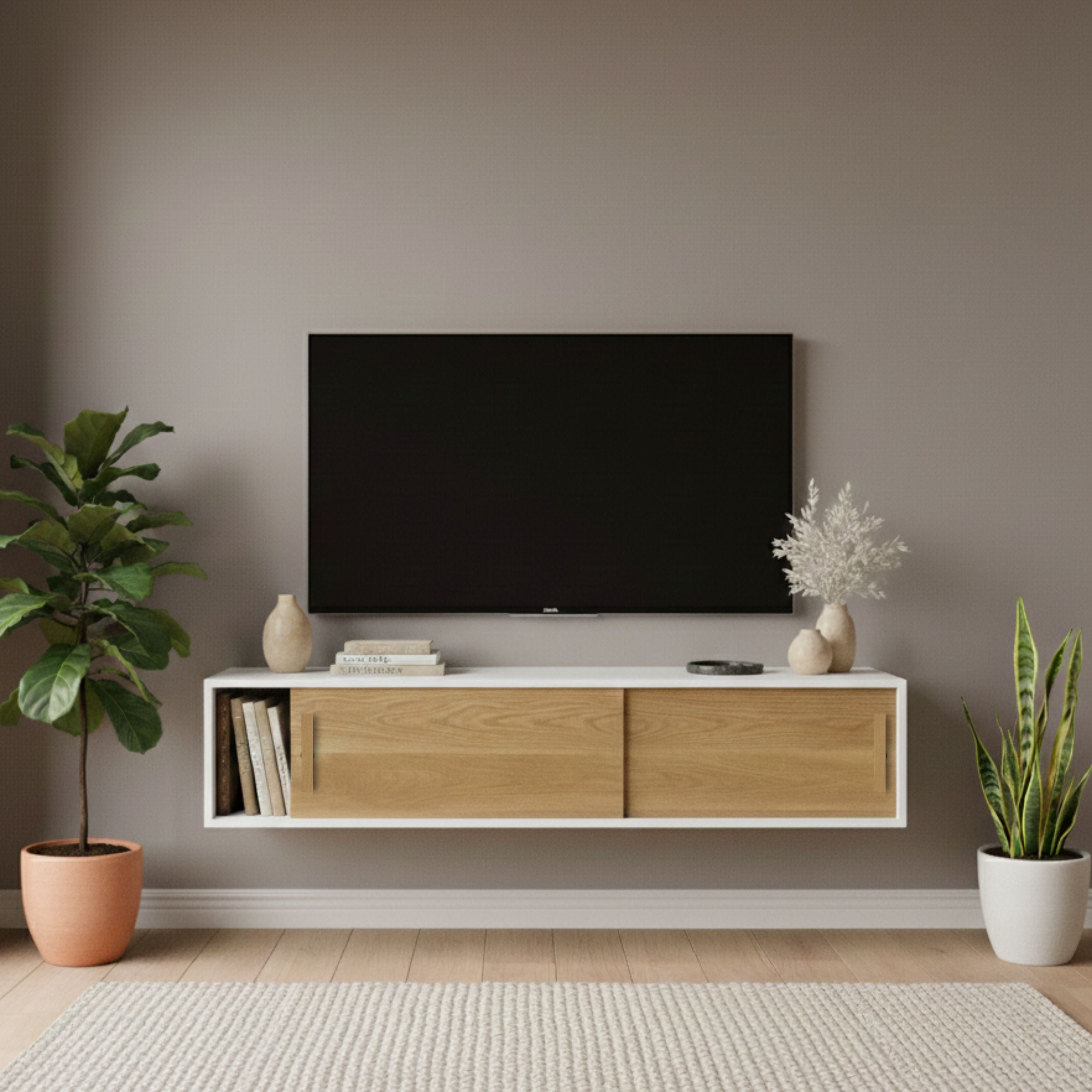 Modern living room with a TV mounted on the wall, wooden cabinet, and decorative plants.
