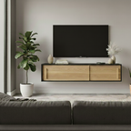Modern living room with a wooden TV stand, plant, and television.
