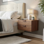Modern bedroom with a bed, nightstand, lamp, and plant.