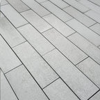 Sleek and sophisticated quartzite garden pavers adding texture and depth to an outdoor space, creating a refined, nature-inspired patio design.
