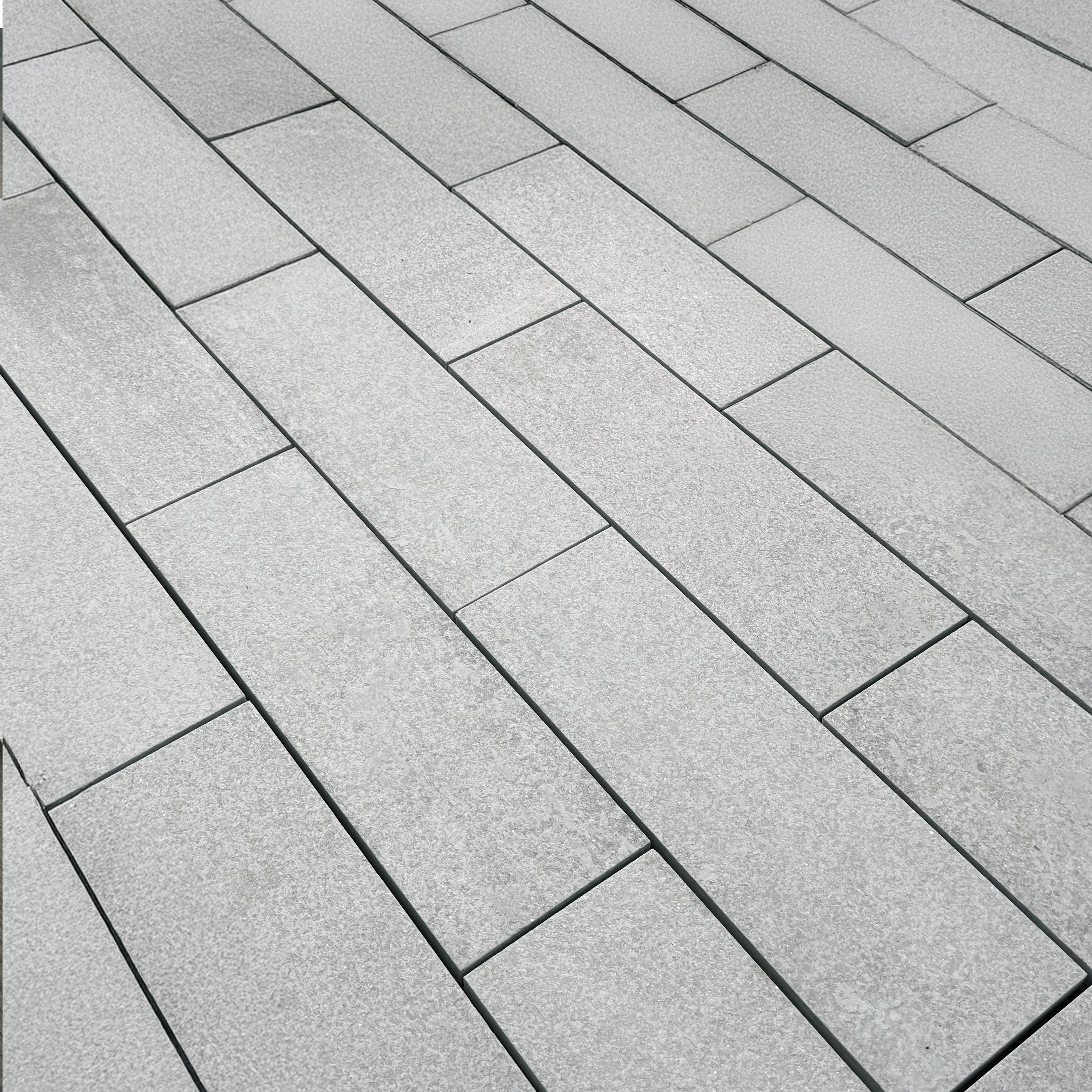 Sleek and sophisticated quartzite garden pavers adding texture and depth to an outdoor space, creating a refined, nature-inspired patio design.
