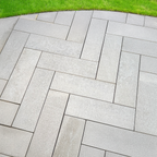 Natural quartzite outdoor pavers creating a luxurious patio space with warm earth tones, perfect for modern garden landscaping and walkways