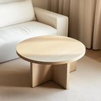 Luxury round white oak coffee table with a sleek and durable build, seamlessly fitting into a modern open-concept living room with natural light