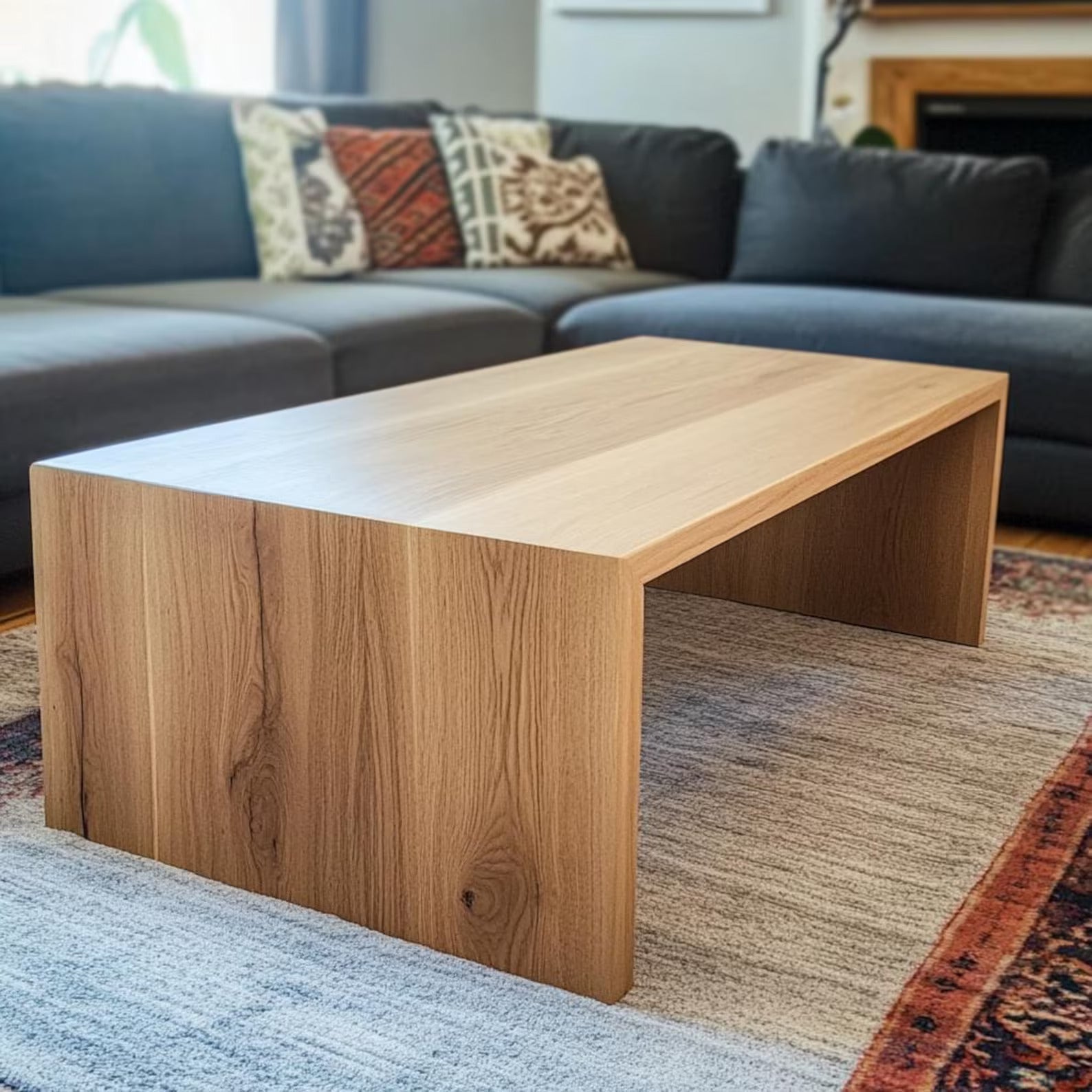 Handcrafted white oak waterfall coffee table with a seamless edge design