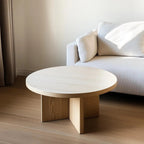 Custom solid oak coffee table with a minimalist design, sitting in an elegant home setting with soft furnishings, wooden elements, and modern decor.