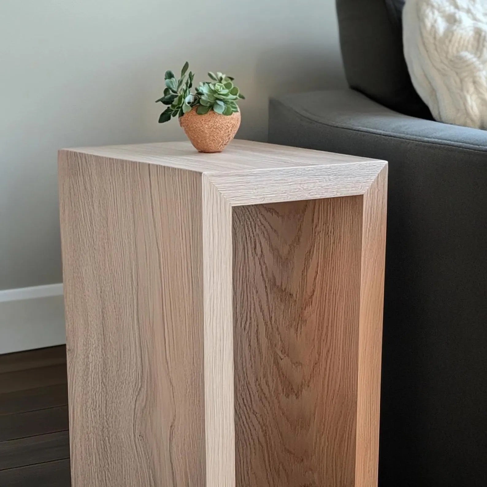Minimalist white oak end table with a natural wood grain finish