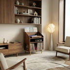 Modern living room with wooden furniture, bookshelf, and floor lamp.